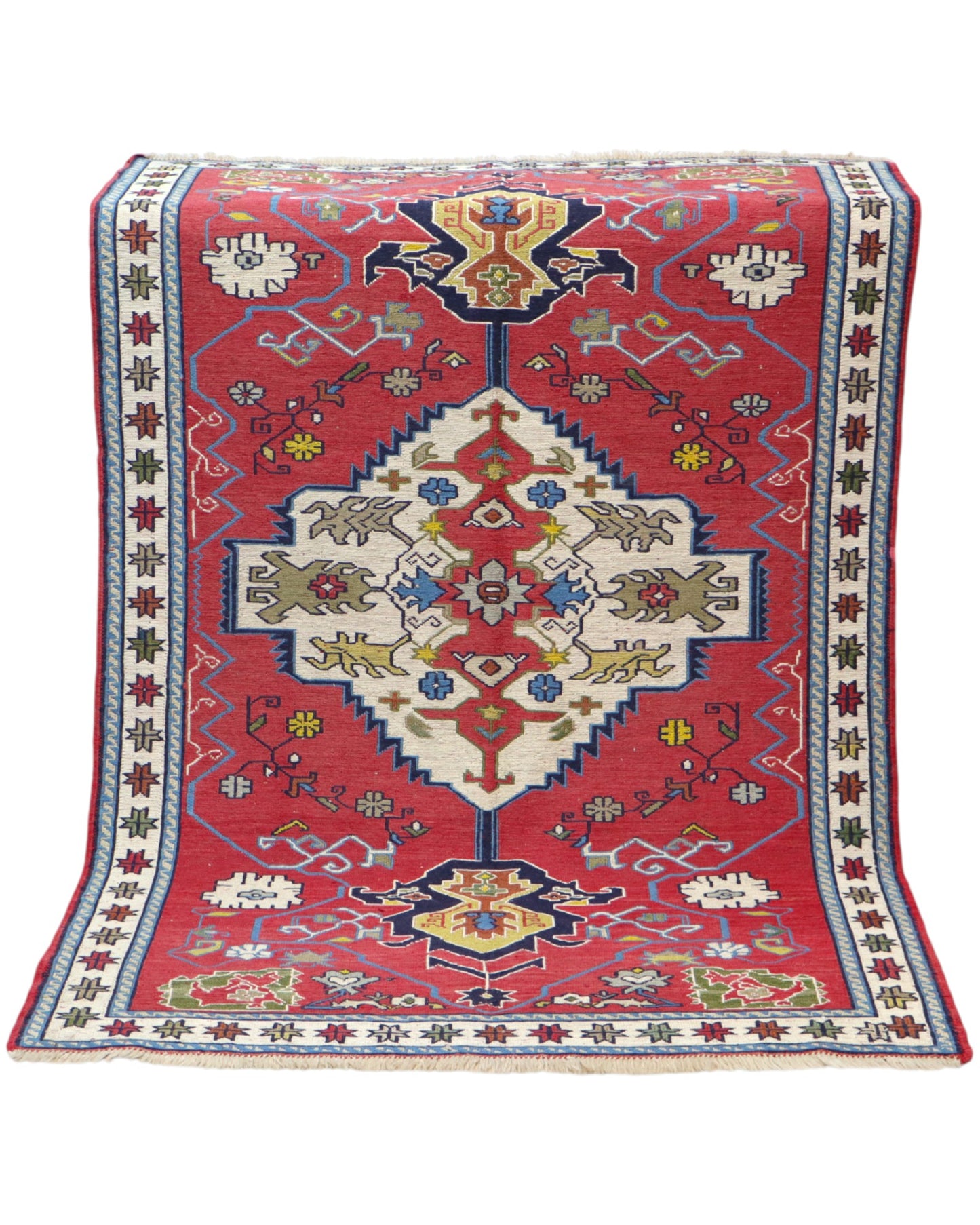 Tappeto Kilim 190x122 cm con motivi geometrici in rosso, blu, giallo e verde su fondo beige.