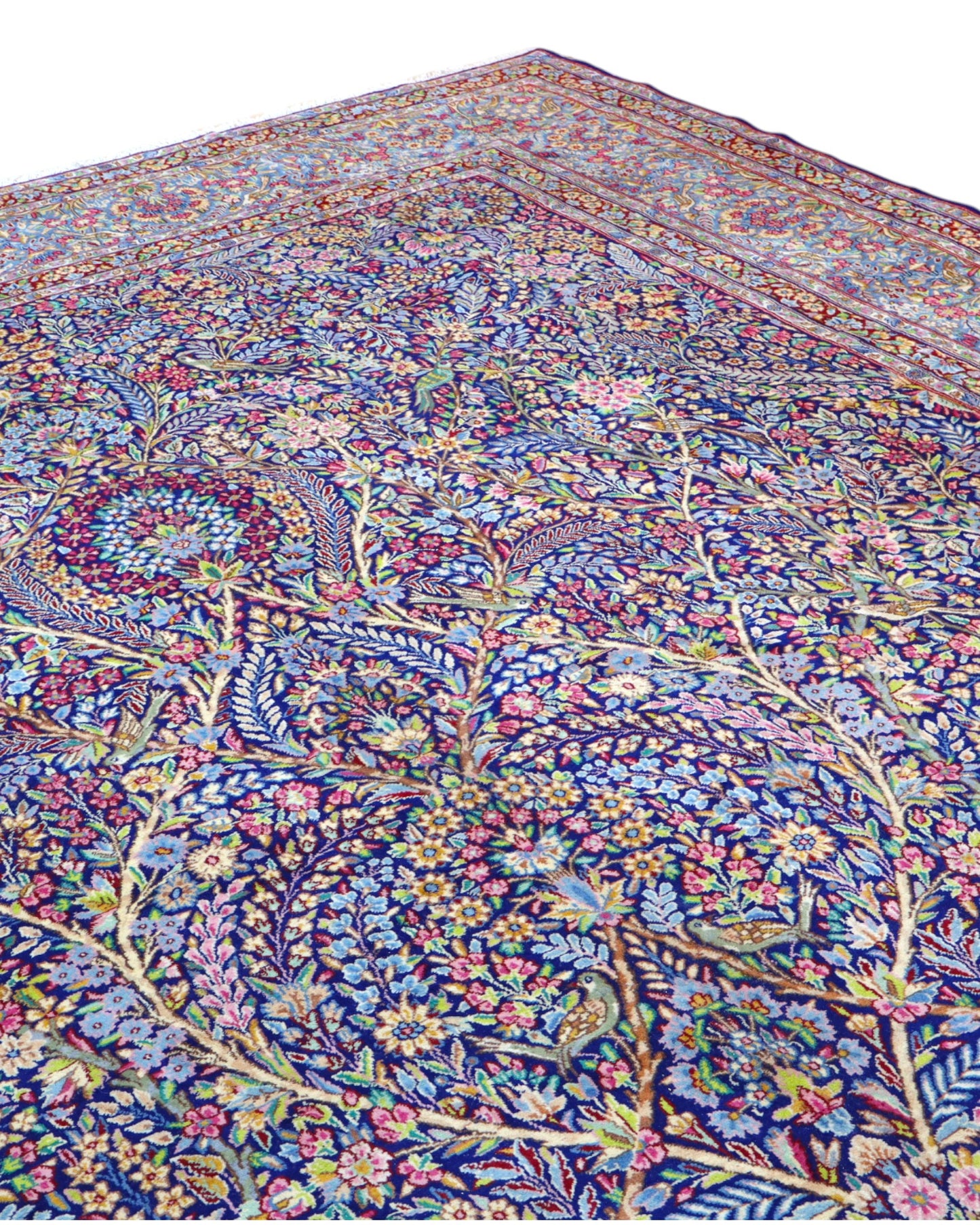 Tappeto Tabriz persiano 486x357 cm rettangolare, annodato a mano, con motivo floreale fitto multicolore su fondo azzurro e blu.