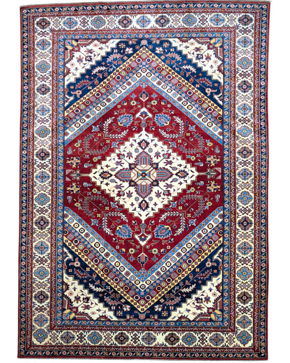 Tappeto Shirvan 274x184 cm con fondo rosso, medaglione centrale blu e avorio e bordure geometriche multicolori, tramato ed annodato a mano.