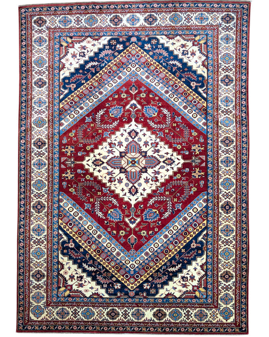 Tappeto Shirvan 274x184 cm con fondo rosso, medaglione centrale blu e avorio e bordure geometriche multicolori, tramato ed annodato a mano.