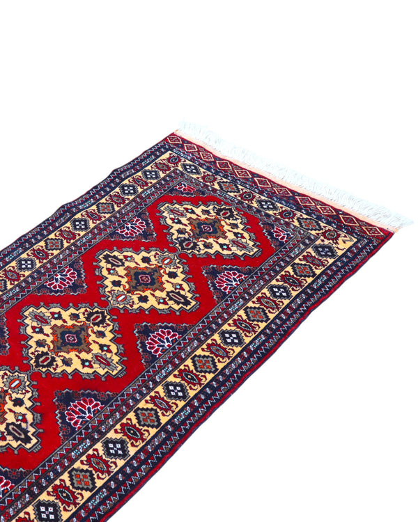 Tappeto Turkman persiano 192x70 cm, corridore con fondo rosso e rombi centrali avorio, annodato a mano in lana.