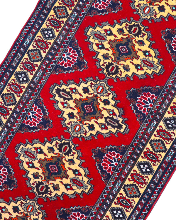 Tappeto Turkman persiano 192x70 cm, corridore con fondo rosso e rombi centrali avorio, annodato a mano in lana.