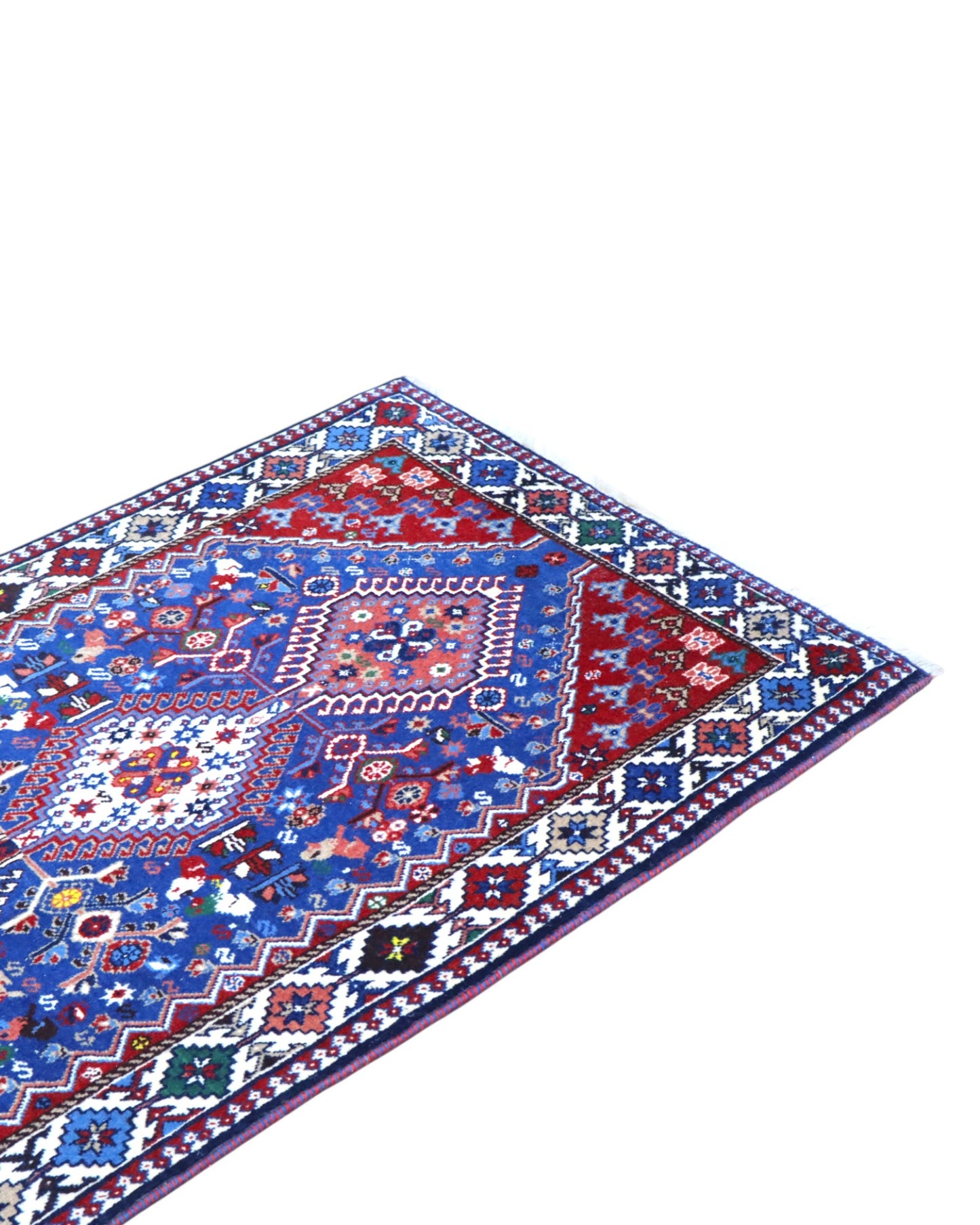 Tappeto persiano Yalameh 204x82 cm, corridore con fondo blu intenso e motivi geometrici rossi, avorio e verdi, annodato a mano in lana vegetale.