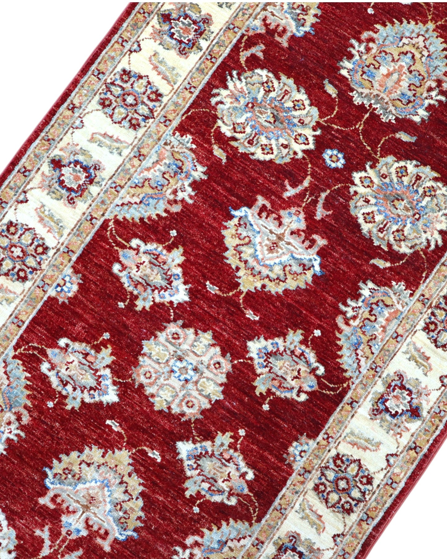 Tappeto Ziegler Afghan 199x83 cm annodato a mano, fondo rosso intenso con decorazioni floreali avorio e cornice chiara.