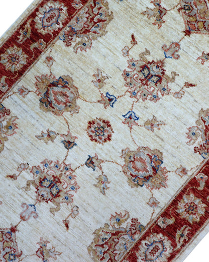 Tappeto Ziegler 190x80 cm fondo chiaro annodato a mano in lana e cotone.