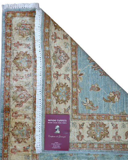 Tappeto Ziegler 257x77 cm, provenienza Afghanistan, fondo azzurro con motivi floreali beige e rosso mattone, corridore annodato a mano in lana vegetale.