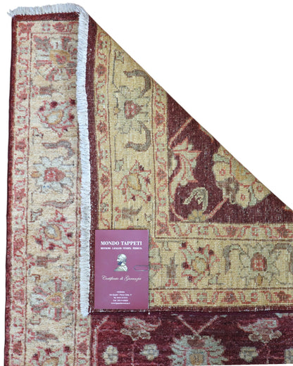 Tappeto Ziegler 261x78 cm, Afghanistan, corridore con fondo rosso borgogna e motivi floreali beige e avorio, annodato a mano in lana vegetale.