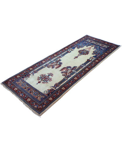 Tappeto Sarough persiano 205x82 cm, corridore con fondo avorio e motivi floreali in blu e rosso, annodato a mano in lana vegetale.