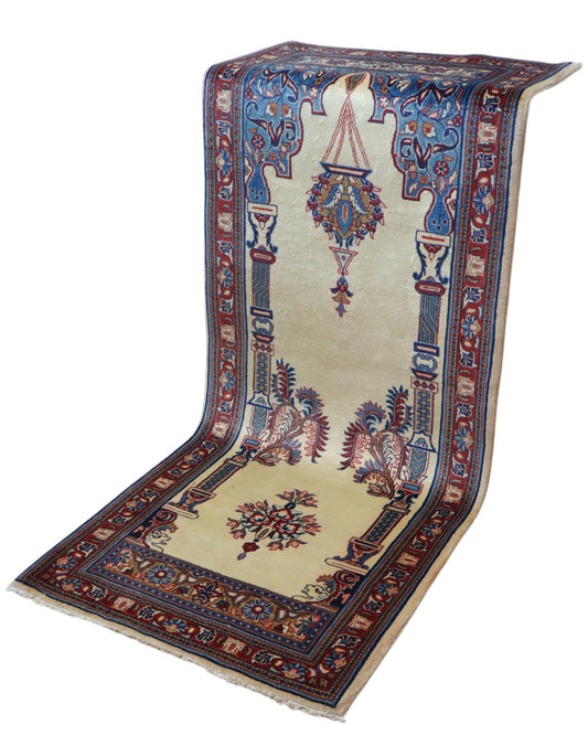 Tappeto Sarough persiano 205x82 cm, corridore con fondo avorio e motivi floreali in blu e rosso, annodato a mano in lana vegetale.