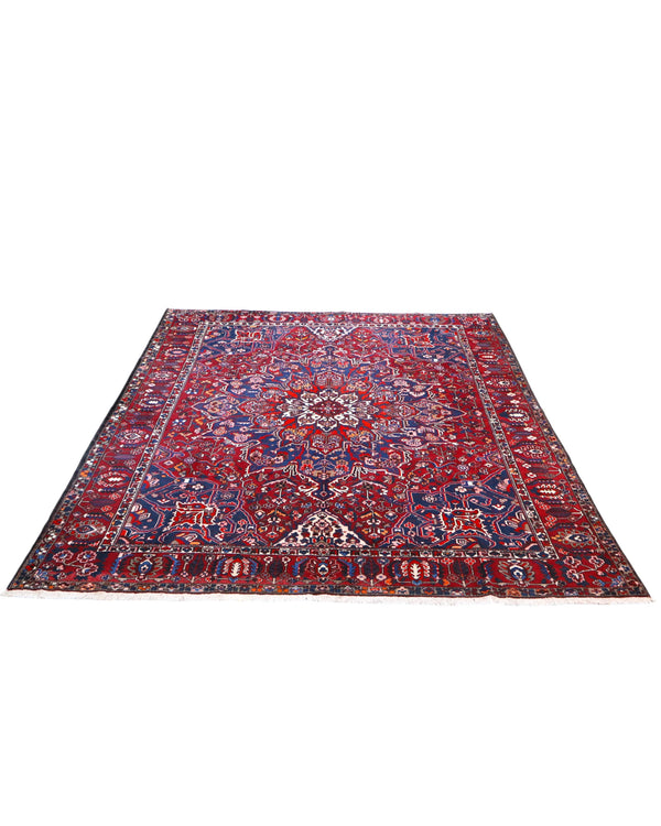 Tappeto Bakhtiar persiano 380x304 cm rettangolare, annodato a mano, con campo rosso, medaglione centrale e motivi floreali blu e avorio.