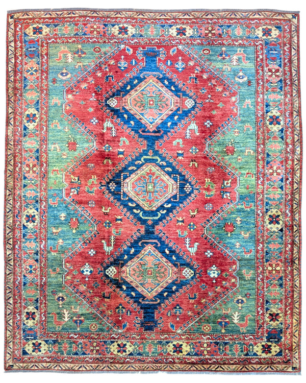 Tappeto Kazak 274x229 cm con fondo rosso e verde, tre medaglioni geometrici blu e dettagli avorio, tramato ed annodato a mano, provenienza Caucaso.