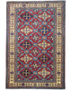 Tappeto Shirvan 289x196 cm con fondo rosso e motivi geometrici gialli, blu e avorio, tramato ed annodato a mano, provenienza Caucaso.