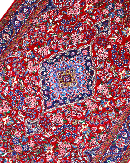 Tappeto Jozan floreale rosso 163x106 cm in camera da letto