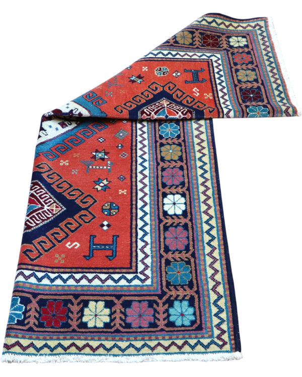 Tappeto rosso con dettagli blu 167x117 cm stile tribale per soggiorno