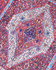Tappeto Sanneh geometrico rosso 150x134 cm in camera da letto