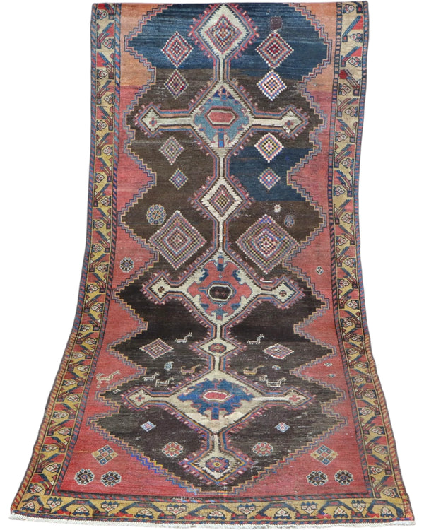 Tappeto Bakhtiyari 238x105 cm annodato a mano con medaglioni geometrici su fondo rosso e blu.