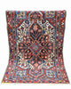 Tappeto Bakhtiyari Antico 185x117 cm con motivi floreali e ampio medaglione centrale su fondo chiaro.