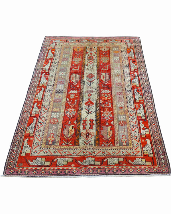Tappeto Caucaso Antico 183x112 cm annodato a mano con fasce geometriche nei toni del rosso e avorio.
