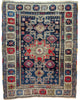 Tappeto Caucaso Antico 150x120 cm annodato a mano con grande medaglione geometrico e motivi tribali.