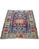 Tappeto Caucaso Antico 150x120 cm annodato a mano con grande medaglione geometrico e motivi tribali.