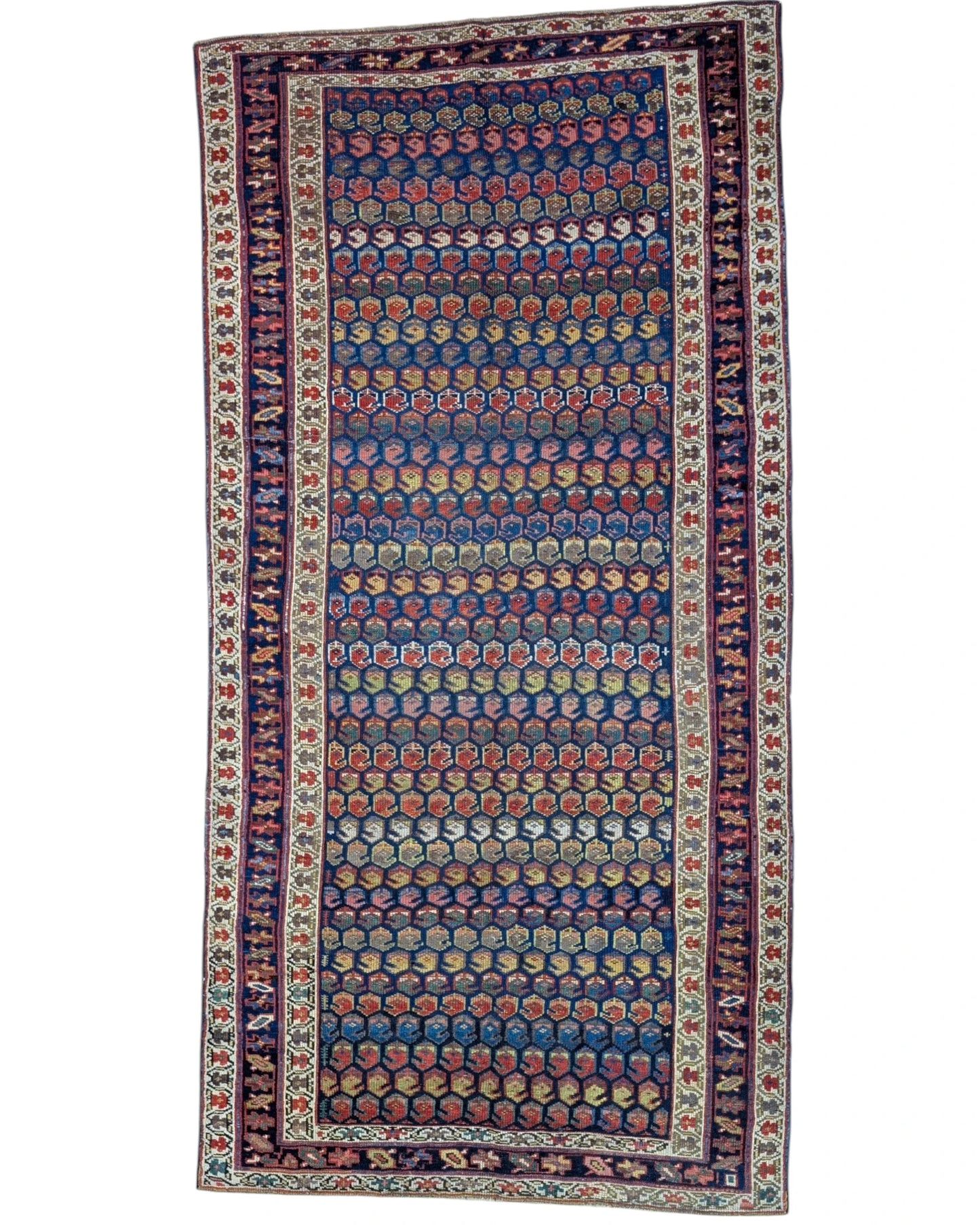 Tappeto Caucaso Antico 266x136 cm annodato a mano con motivo geometrico su fondo blu intenso.