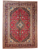 Tappeto persiano Kashan 402x297 cm, fondo rosso con medaglione centrale blu e avorio, annodato a mano in lana vegetale.