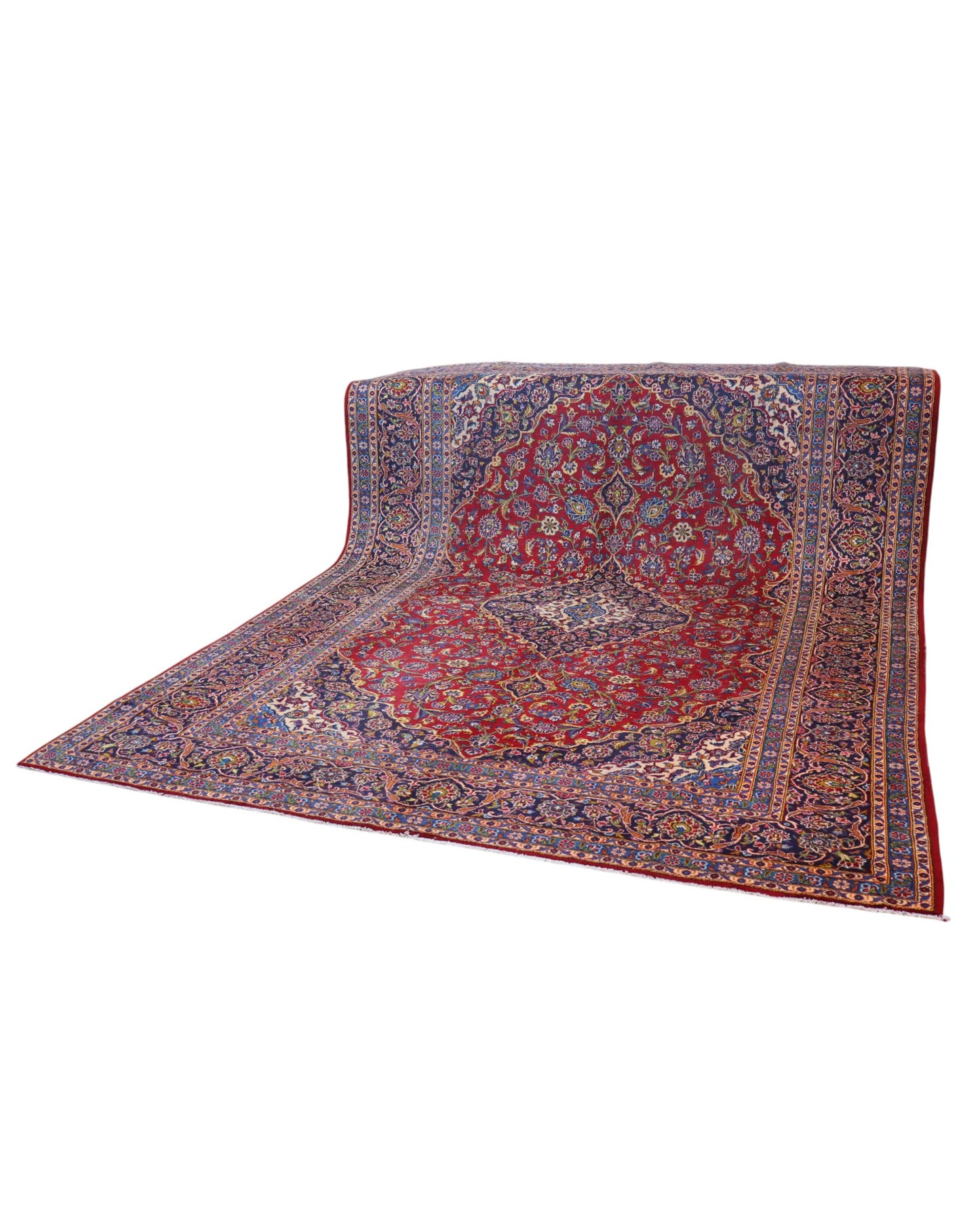 Tappeto persiano Kashan 400x290 cm, fondo rosso con medaglione centrale blu e avorio, cornice scura floreale, annodato a mano in lana vegetale.