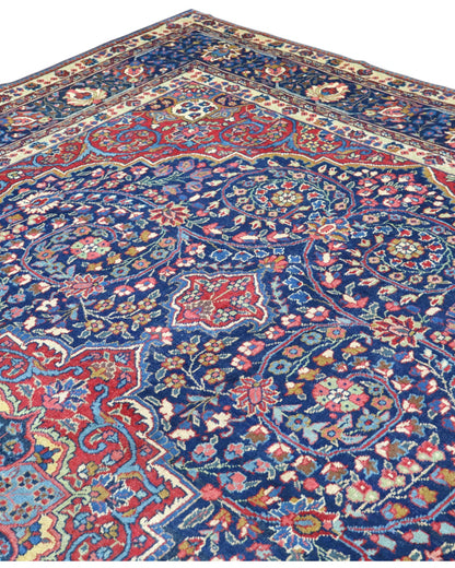 tappeto persiano Khoi annodato a mano 385x283 cm blu e rosso con medaglione centrale e motivi floreali