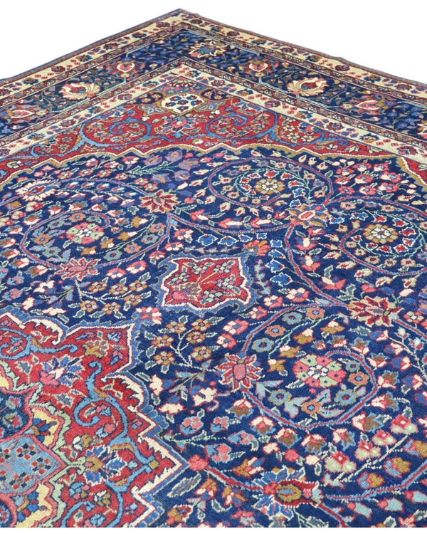 tappeto persiano Khoi annodato a mano 385x283 cm blu e rosso con medaglione centrale e motivi floreali