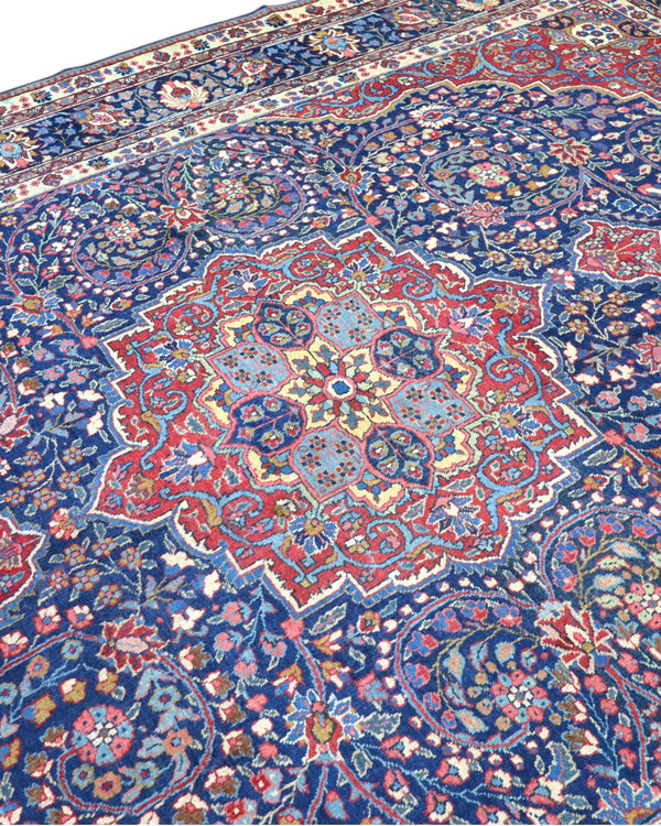 tappeto persiano Khoi annodato a mano 385x283 cm blu e rosso con medaglione centrale e motivi floreali