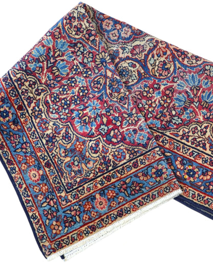 Tappeto Persiano Liliyan 180x50 cm annodato a mano nei toni del rosso e del blu.