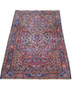 Tappeto Liliyan 180x50 cm annodato a mano con medaglione floreale e bordure blu decorate.