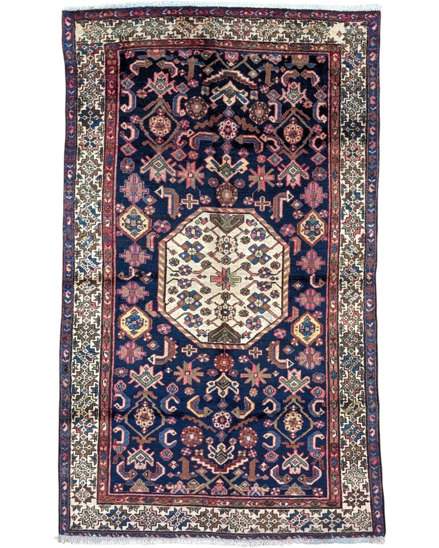 Tappeto Caucaso Antico 188x115 cm annodato a mano con medaglione ottagonale e motivi geometrici tribali.