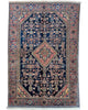 Tappeto Malayer Antico 191x132 cm annodato a mano con medaglione romboidale su fondo blu scuro.