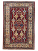 Tappeto Shirvan 154x102 cm, annodato a mano in Persia, fondo rosso con motivi geometrici blu, giallo e beige, lana pregiata e cotone resistente, certificato di autenticità incluso.