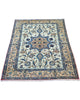 Tappeto Najafabad beige e blu 159x106 cm in salotto luminoso