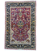 Tappeto persiano Isfahan 173x110cm rosso e blu in soggiorno elegante.