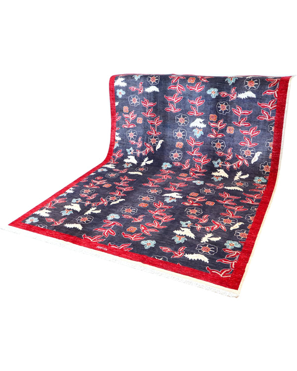 Tappeto in lana 292x216 cm con bordo rosso e fondo blu per zona living elegante.