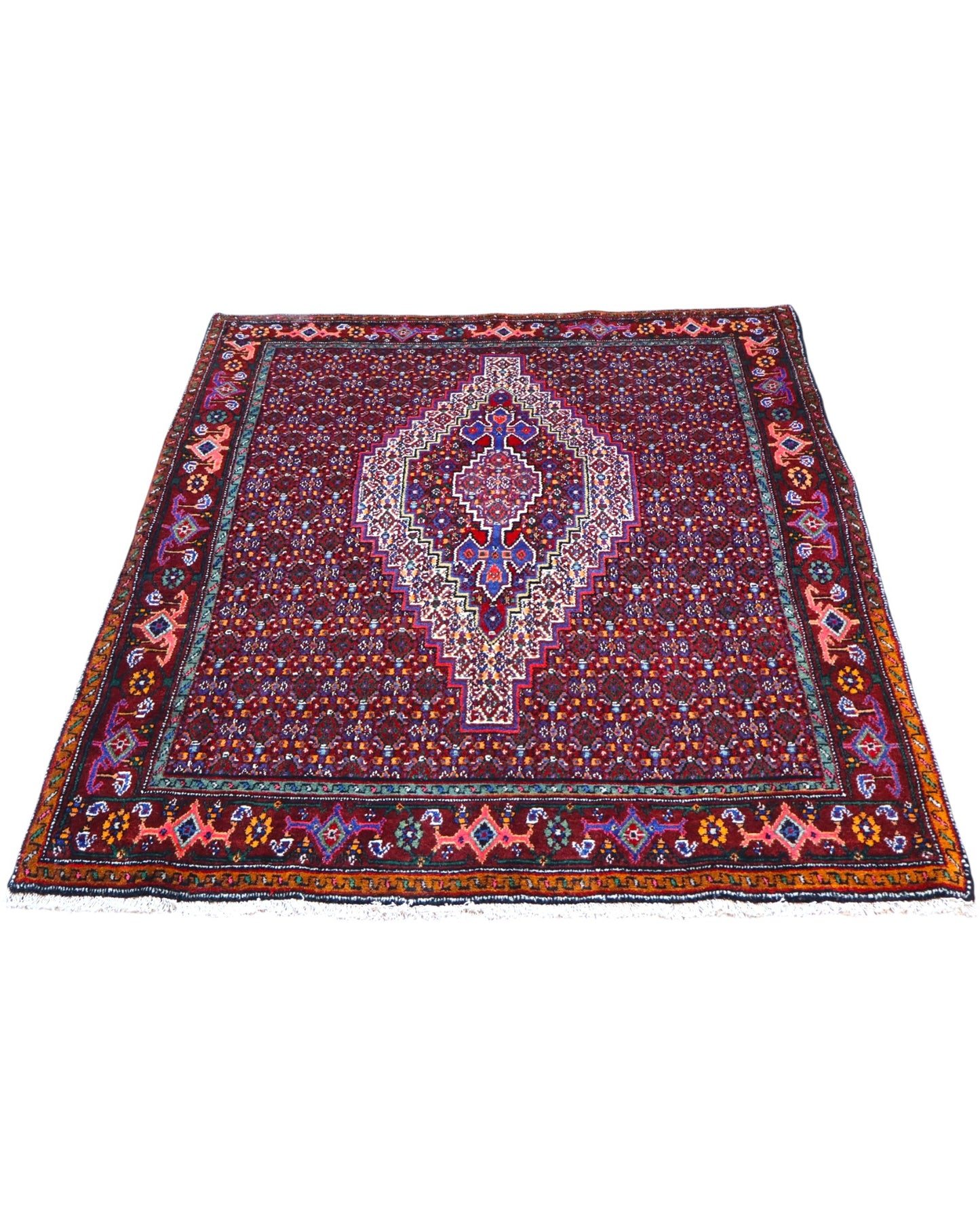 Tappeto Sanneh rosso 147x130 cm con disegni multicolore in salotto