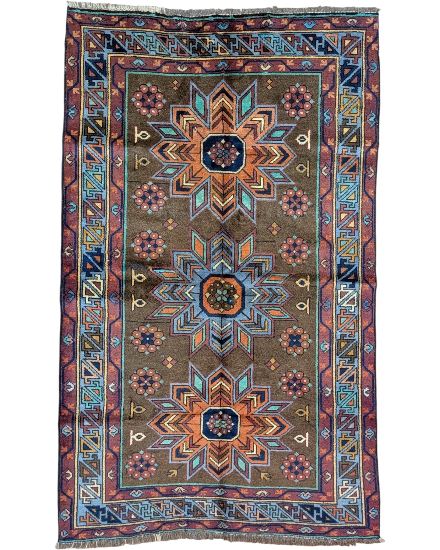 Tappeto Caucaso Antico 188x115 cm annodato a mano con tre medaglioni stellati e motivi geometrici tribali.