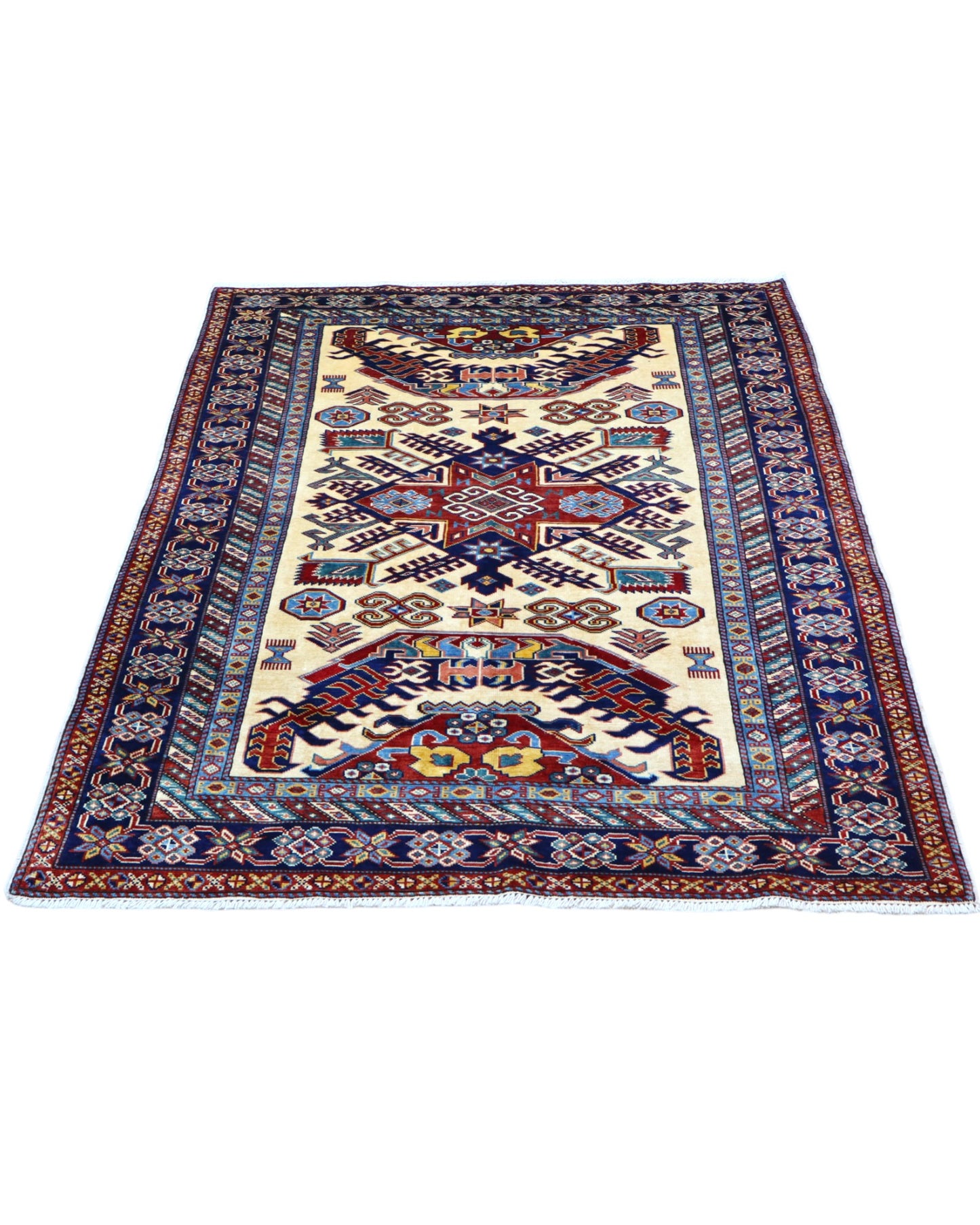 Tappeto Shirvan Afghan 157x121 cm con fondo avorio, motivi geometrici blu e rossi, tramato ed annodato a mano, provenienza Afghanistan.