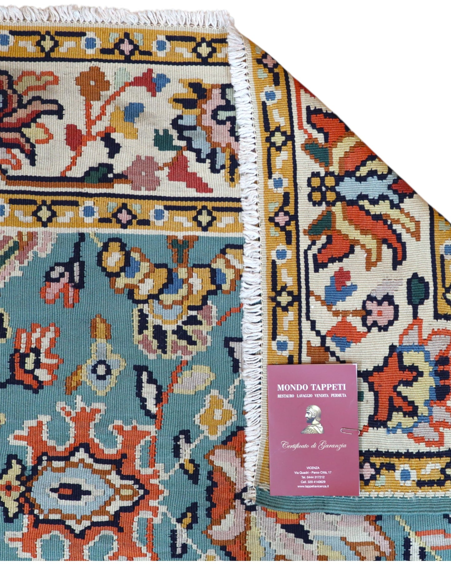 Tappeto Kilim Turco 290x200 cm con fondo azzurro, motivi floreali e geometrici multicolori, tramato ed annodato a mano.