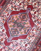 Tappeto Hamedan geometrico beige e rosso 158x108 cm in camera da letto