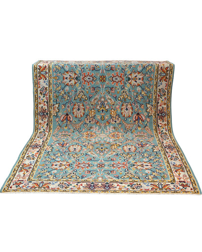 Tappeto Kilim Turco 290x200 cm con fondo azzurro, motivi floreali e geometrici multicolori, tramato ed annodato a mano.