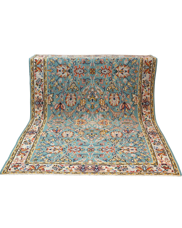 Tappeto Kilim Turco 290x200 cm con fondo azzurro, motivi floreali e geometrici multicolori, tramato ed annodato a mano.