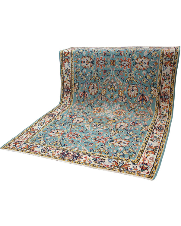 Tappeto Kilim Turco 290x200 cm con fondo azzurro, motivi floreali e geometrici multicolori, tramato ed annodato a mano.