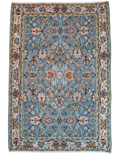 Tappeto Kilim Turco 290x200 cm con fondo azzurro, motivi floreali e geometrici multicolori, tramato ed annodato a mano.