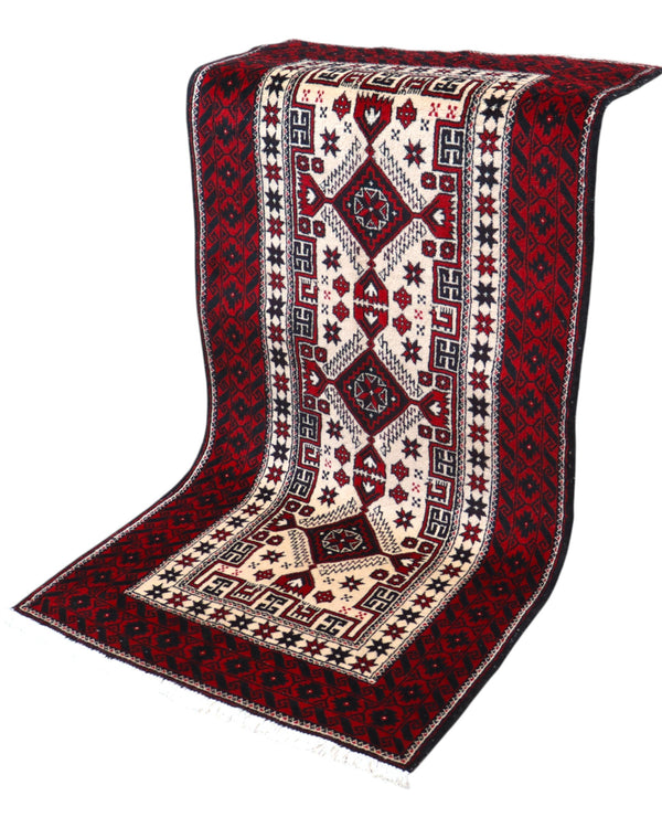 Tappeto Balochistan 187x95 cm annodato a mano, fondo avorio con motivi geometrici rossi, neri e verdi.