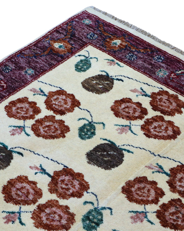 Tappeto Ziegler annodato a mano 180x126 cm con motivi floreali su fondo avorio e bordura viola.