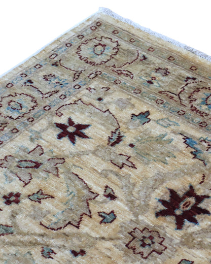 Tappeto Ziegler 182x125 cm con fondo beige e motivi floreali marroni e azzurri, tramato ed annodato a mano, provenienza Afghanistan.